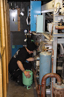 a refrigeration technician at work