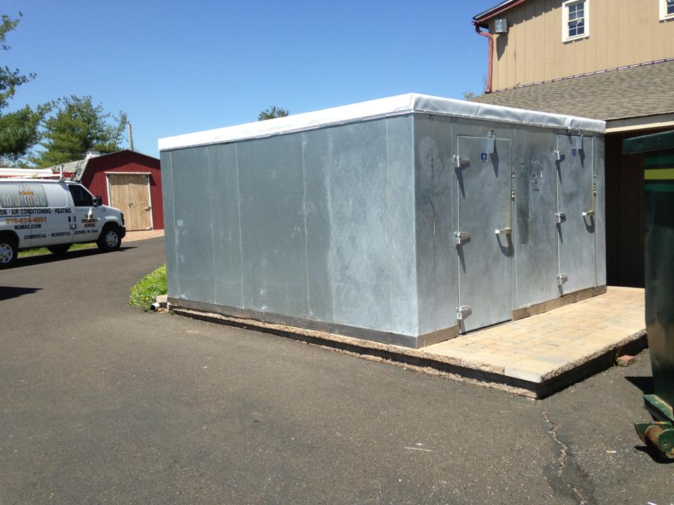 a large walk in box and refrigerator