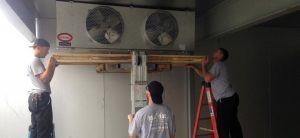 m. j. mac team installs an ac unit